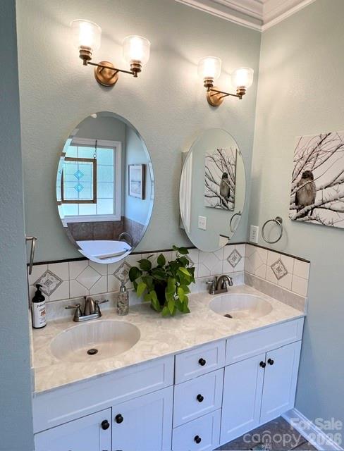 183 Burl Bridges Road Forest City, NC 28043 - Photo 18 of 31 a bathroom with a double vanity sink and a mirror