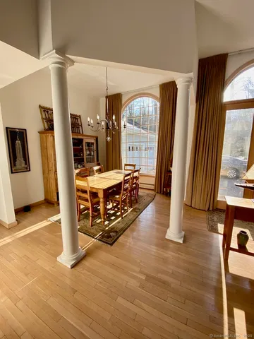 a kitchen with granite countertop a sink dishwasher stove and cabinets