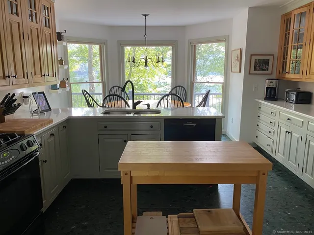 a view of a dining room with furniture window and outside view
