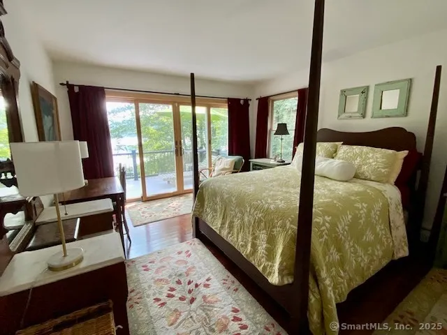 a bedroom with bed and window