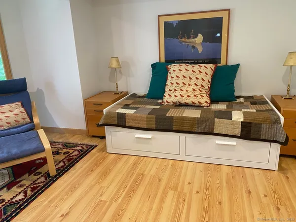 a living room with furniture and a rug