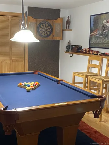 a street sign that is sitting in front of flowers