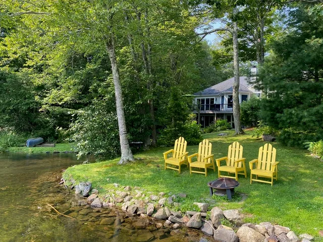 a view of a chair and table in the garden