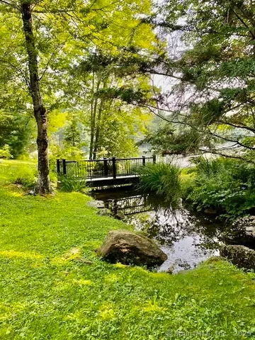 a garden view with a lake