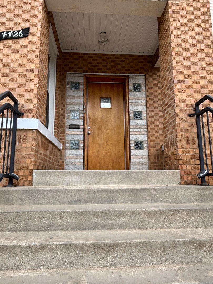 4426 South Talman Avenue, Unit G Chicago, IL 60632 - Photo 2 of 11 a view of entrance door of the house
