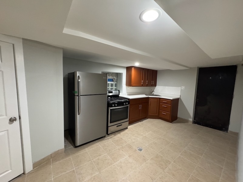 4426 South Talman Avenue, Unit G Chicago, IL 60632 - Photo 5 of 11 a kitchen with stainless steel appliances a refrigerator and a stove top oven