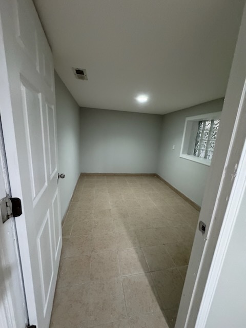 4426 South Talman Avenue, Unit G Chicago, IL 60632 - Photo 8 of 11 an empty room with windows