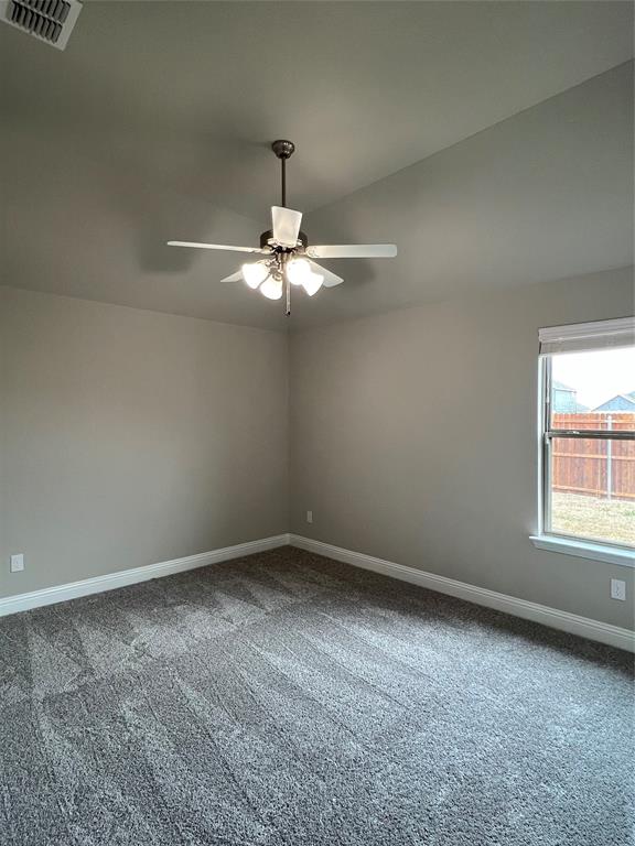 277 Eagle Ridge Forney, TX 75126 - Photo 16 of 19 Spare room with dark carpet and a ceiling fan