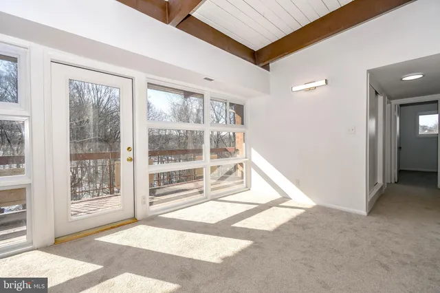 a view of a room with a large window