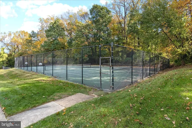 a view of a backyard with fence