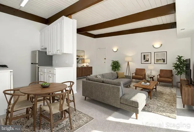 a living room with furniture and a table