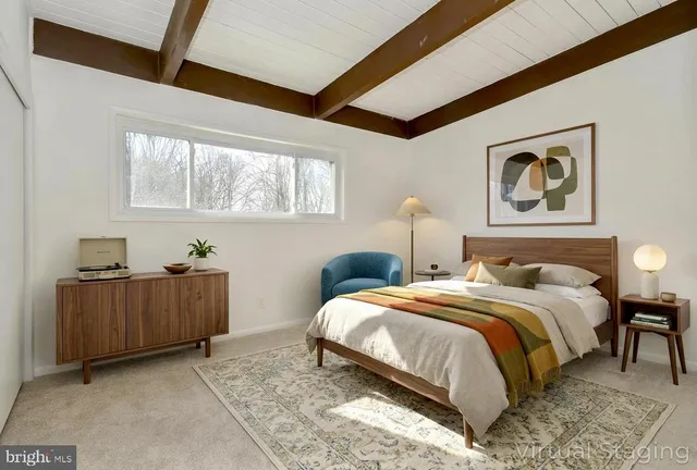 a bedroom with bed and window