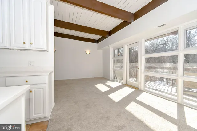 a view of a room with a large window