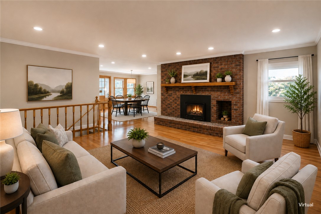 130 Raleighs Lane West Union, SC 29696 - Photo 9 of 49 Polished hardwood floors and a brick fireplace create a warm, inviting living space.