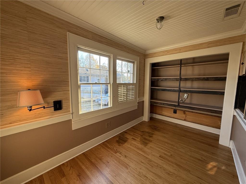 952 Wayside Street Cornelia, GA 30531 - Photo 14 of 50 a view of an empty room with a window and wooden floor