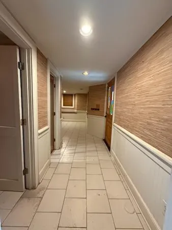 a bathroom with a glass door shower and a sink