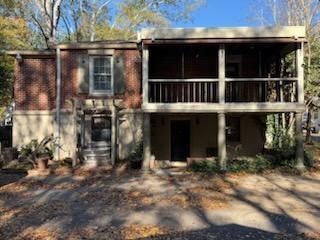 952 Wayside Street Cornelia, GA 30531 - Photo 44 of 50 a view of a house with a large window and potted plants
