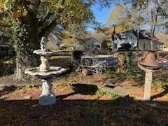 a kitchen with granite countertop a refrigerator and a sink