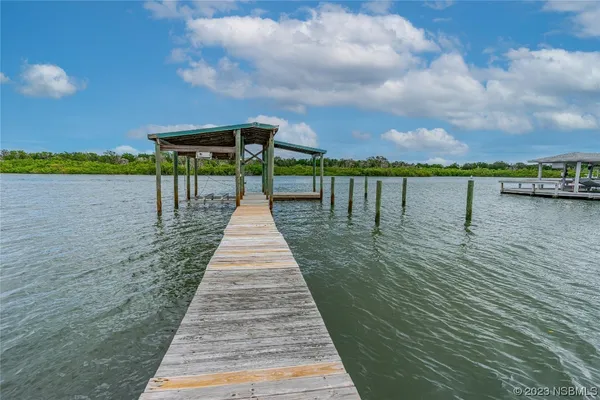 a front view of a house with a lake view