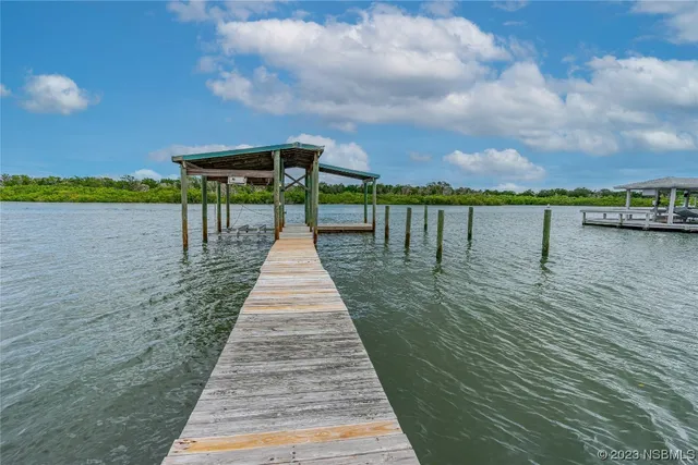 a front view of a house with a lake view