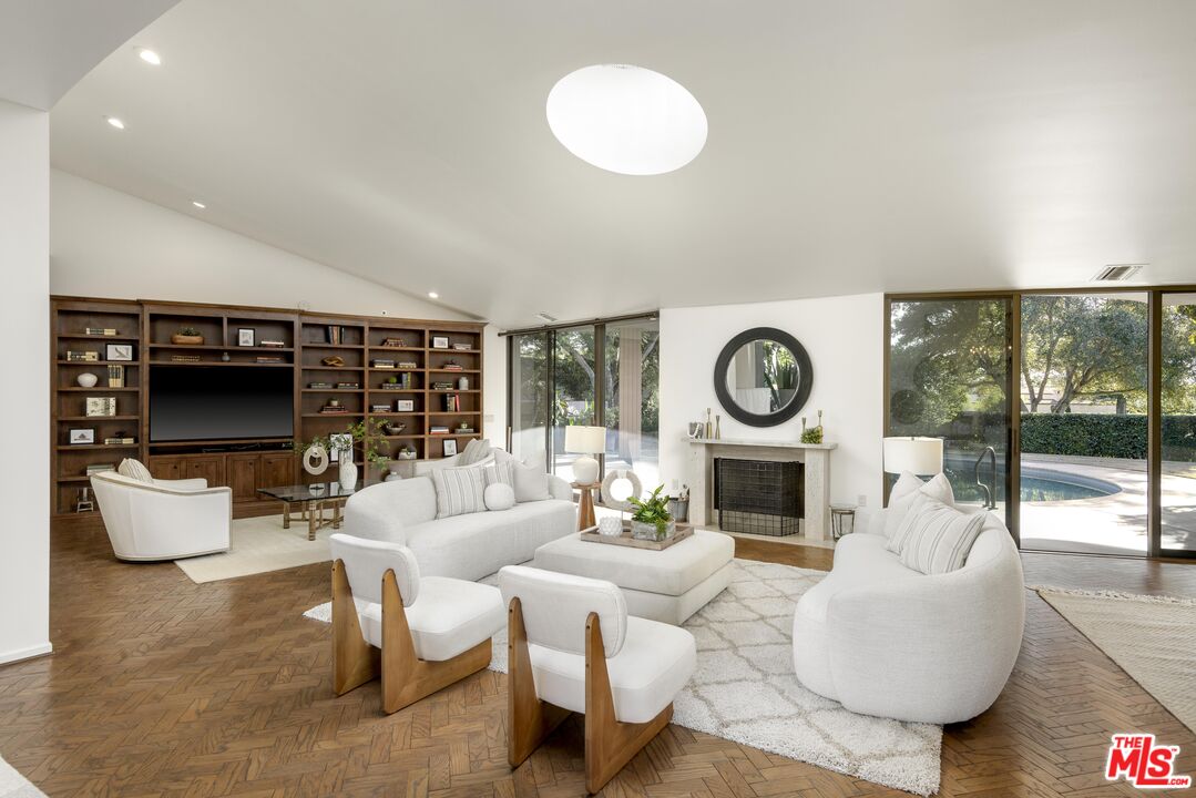 2141 10 Acre Road Santa Barbara, CA 93108 - Photo 4 of 21 a living room with furniture a rug and a fireplace