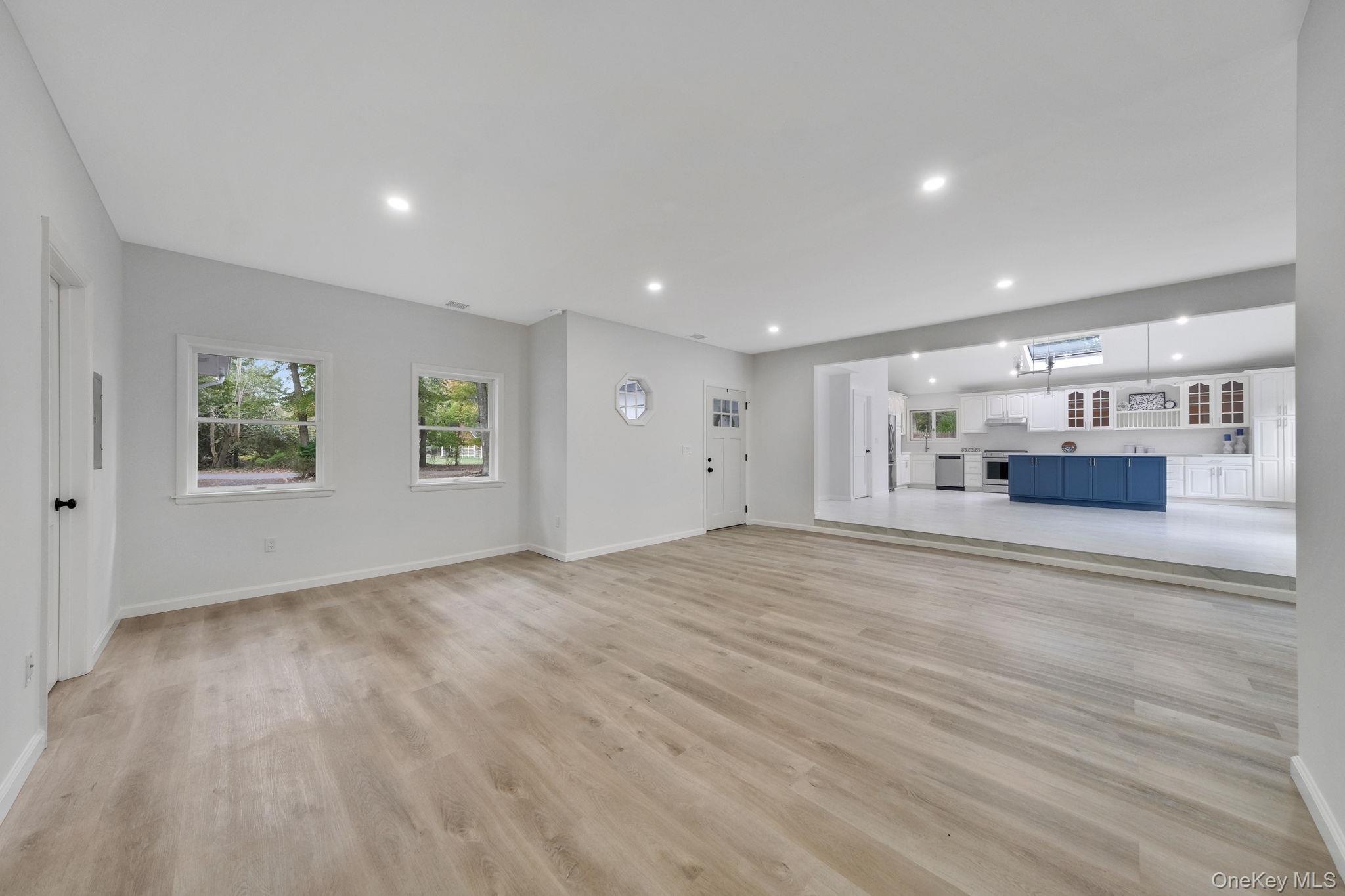 11 Wildwood Road Ridge, NY 11961 - Photo 3 of 17 Unfurnished living room with recessed lighting and light wood-style flooring