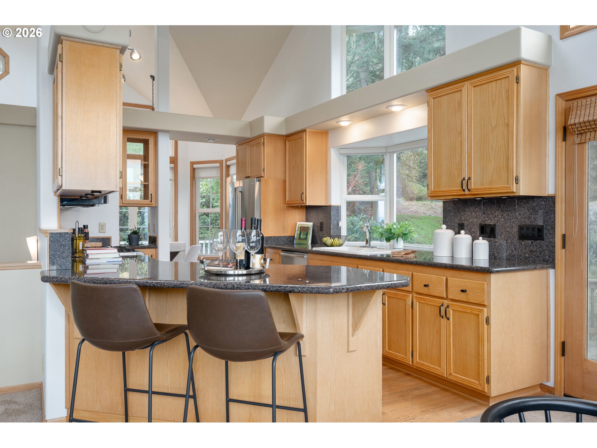 653 Brookside Drive Eugene, OR 97405 - Photo 16 of 48 a kitchen with appliances cabinets and chair