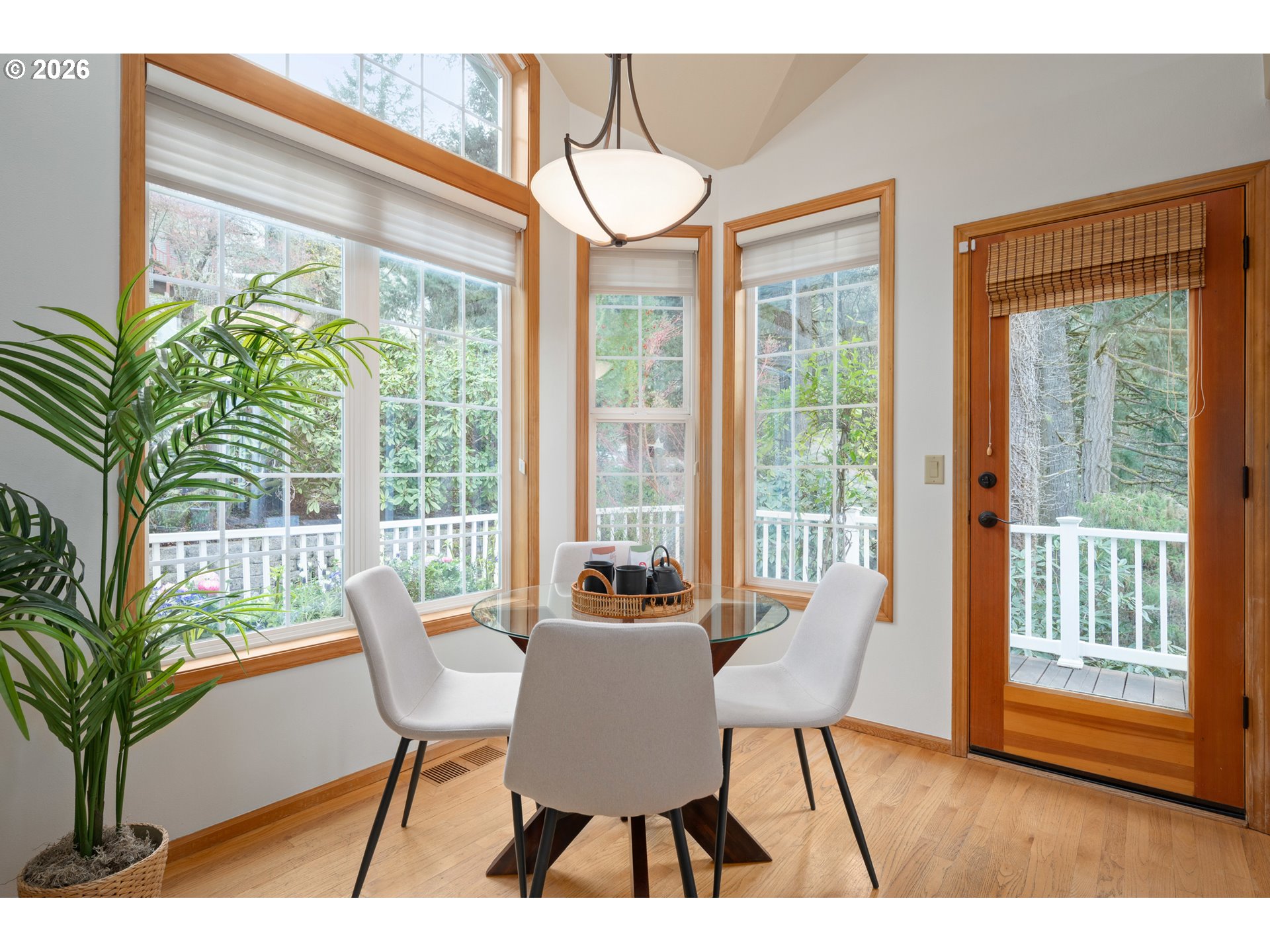 653 Brookside Drive Eugene, OR 97405 - Photo 20 of 48 a dining room with furniture a chandelier and wooden floor