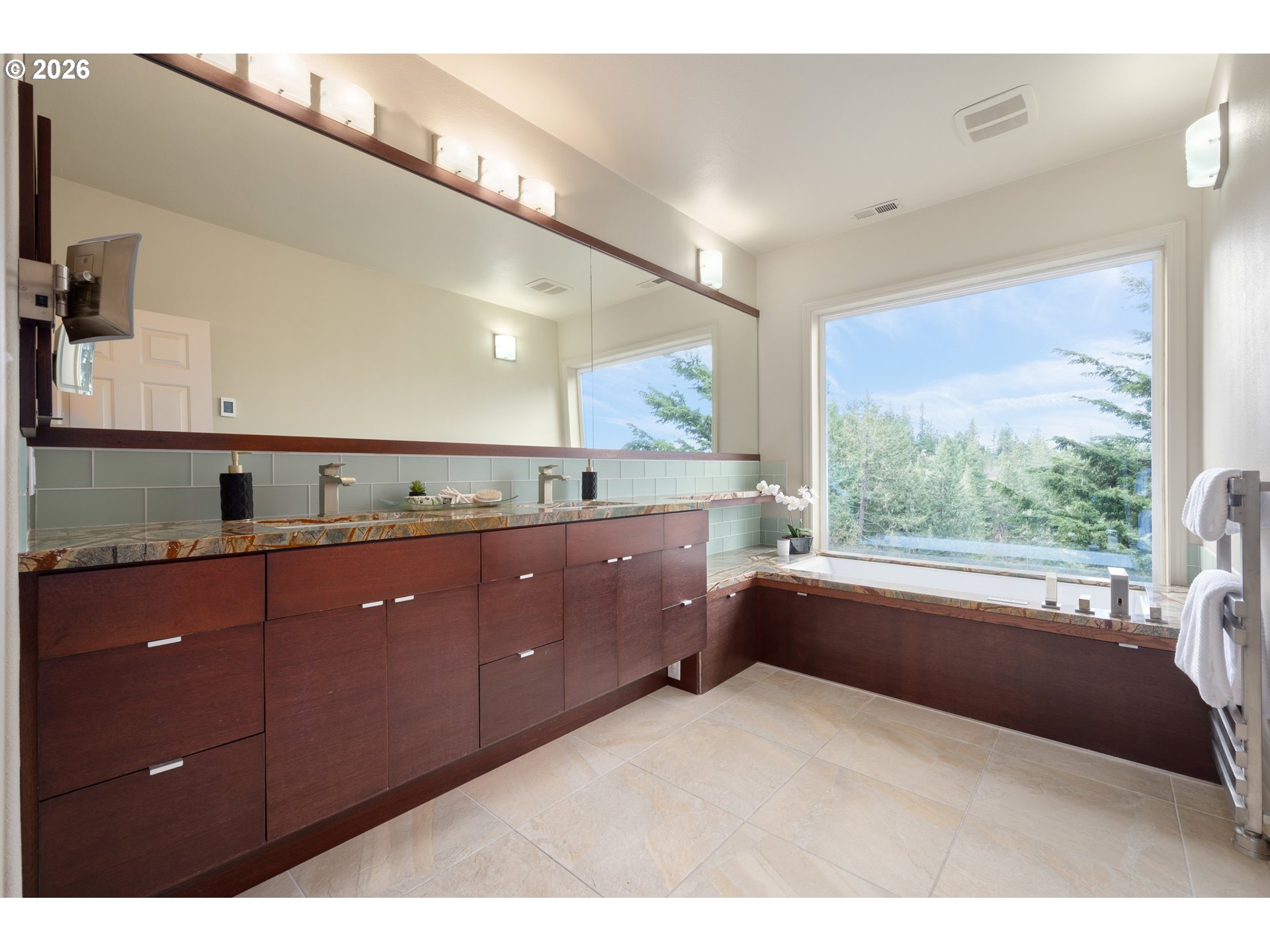 653 Brookside Drive Eugene, OR 97405 - Photo 28 of 48 a spacious bathroom with a granite countertop sink mirror and a bathtub