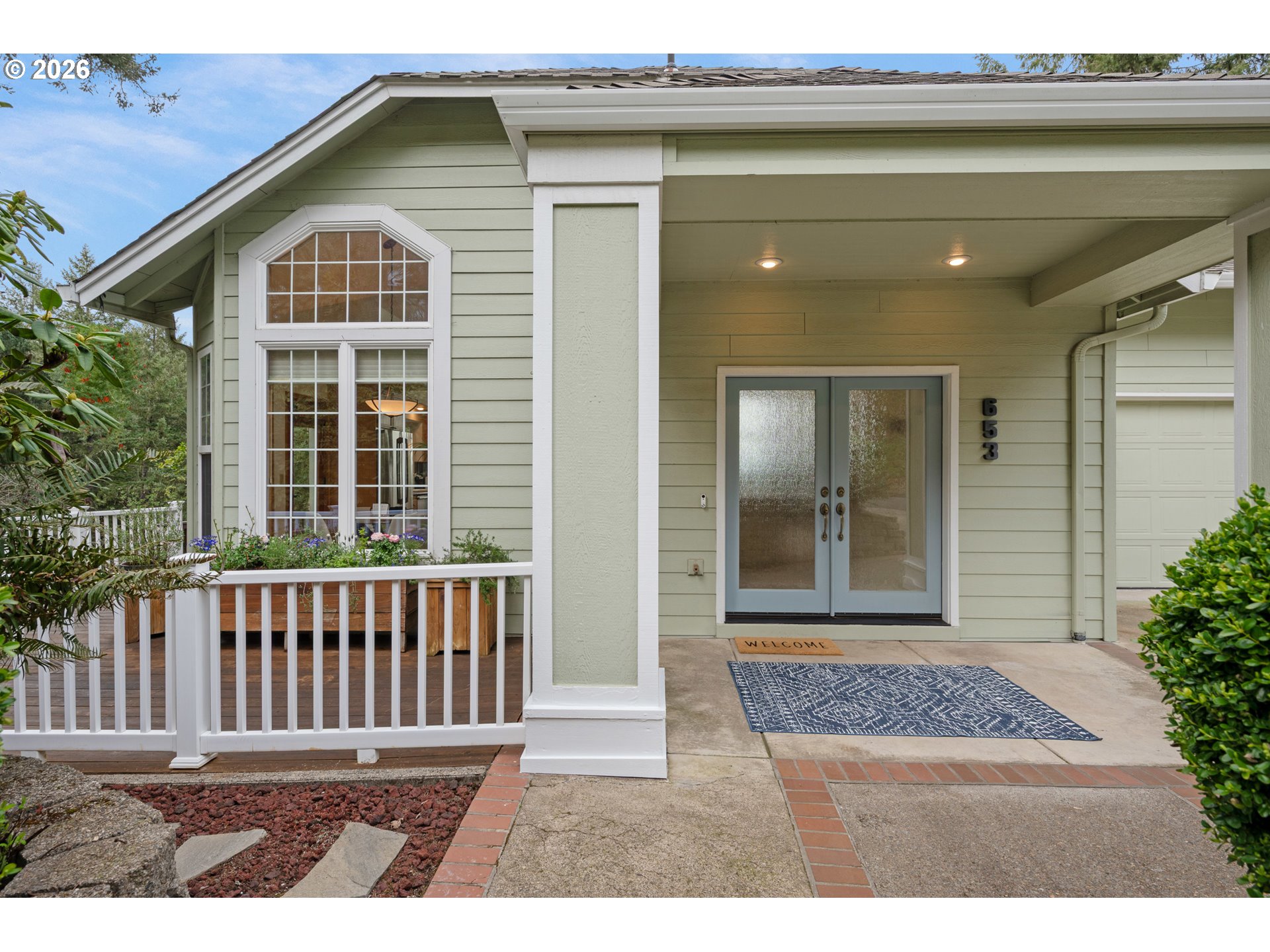 653 Brookside Drive Eugene, OR 97405 - Photo 3 of 48 a front view of a house with a porch