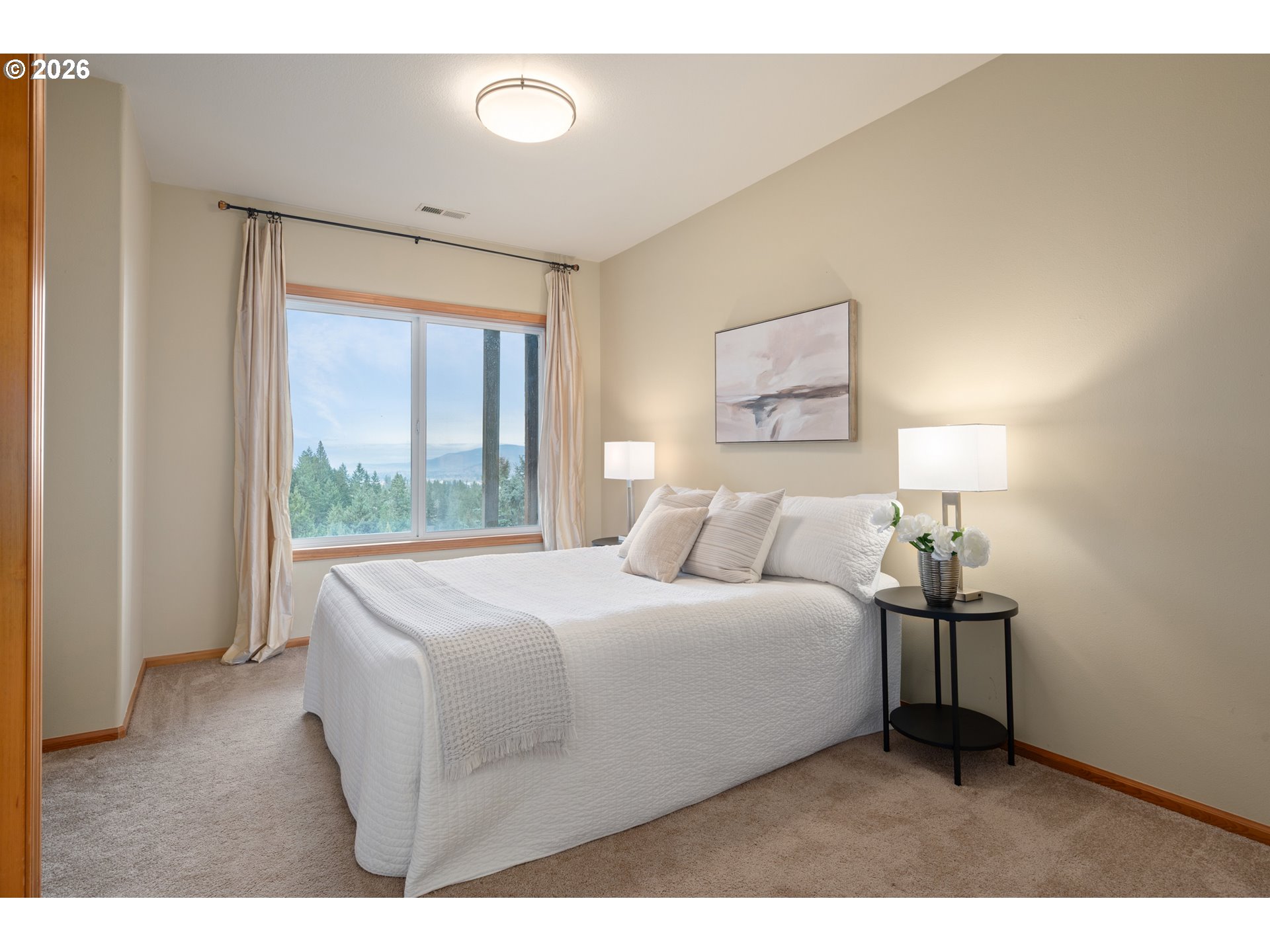 653 Brookside Drive Eugene, OR 97405 - Photo 34 of 48 a bedroom with a bed and a lamp