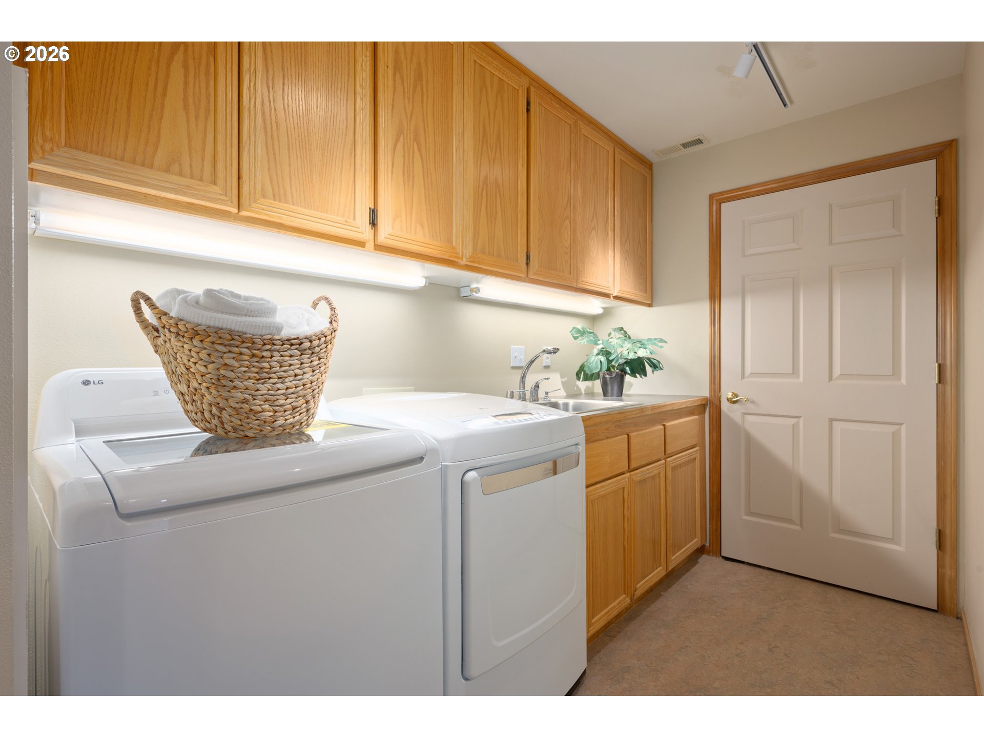 653 Brookside Drive Eugene, OR 97405 - Photo 40 of 48 a kitchen with stainless steel appliances granite countertop a sink a cabinets and wooden floor