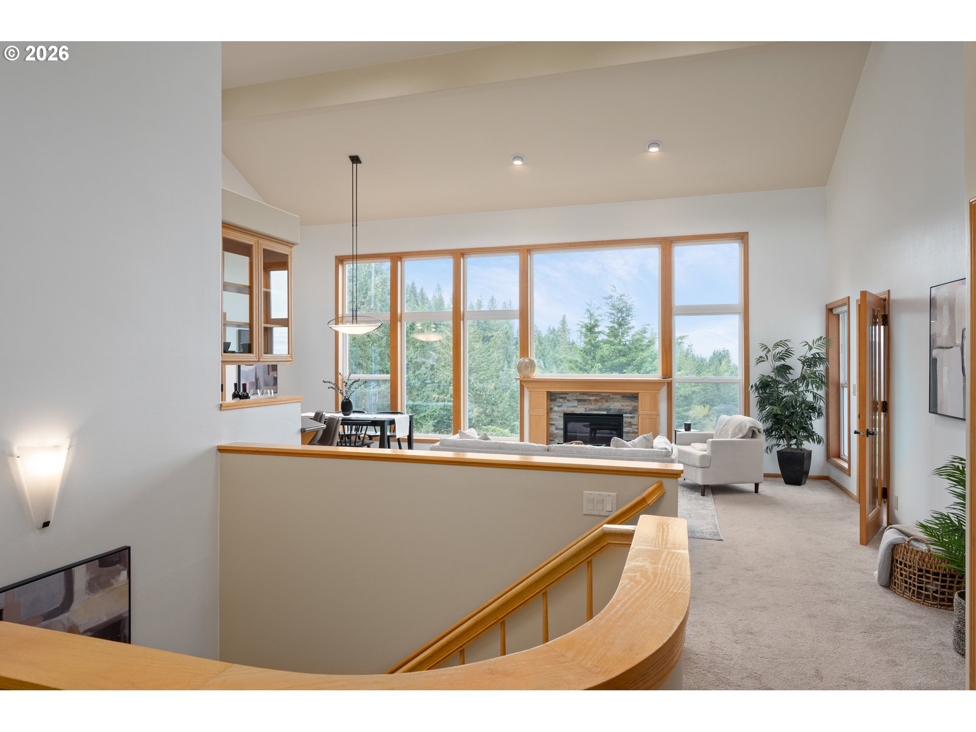 653 Brookside Drive Eugene, OR 97405 - Photo 4 of 48 a living room with furniture a large window and a chandelier