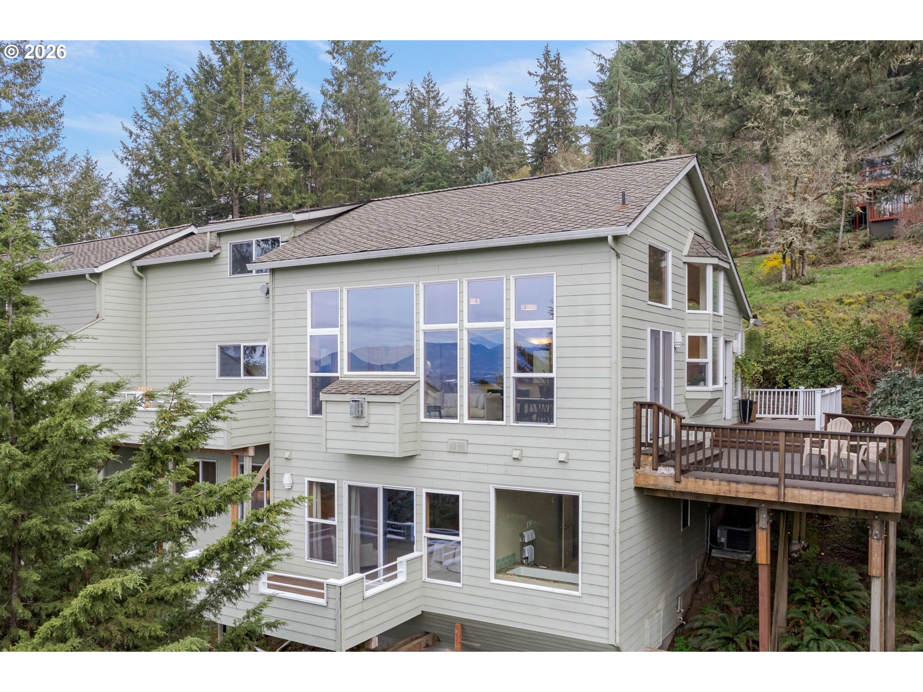 653 Brookside Drive Eugene, OR 97405 - Photo 42 of 48 a aerial view of a house with balcony and trees al around