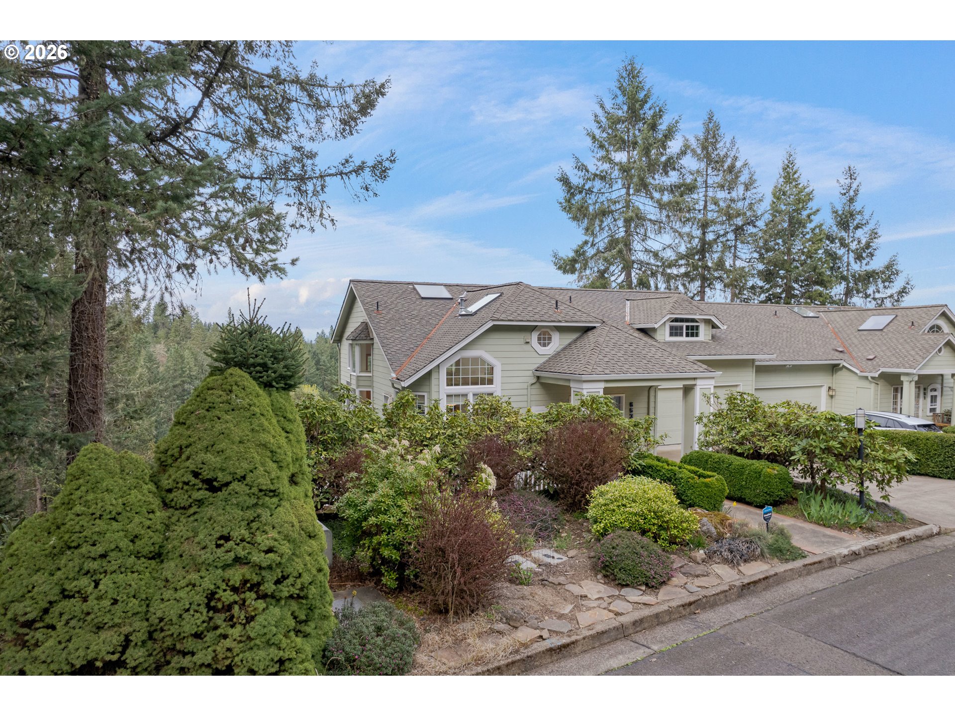 653 Brookside Drive Eugene, OR 97405 - Photo 44 of 48 a front view of a house with a garden
