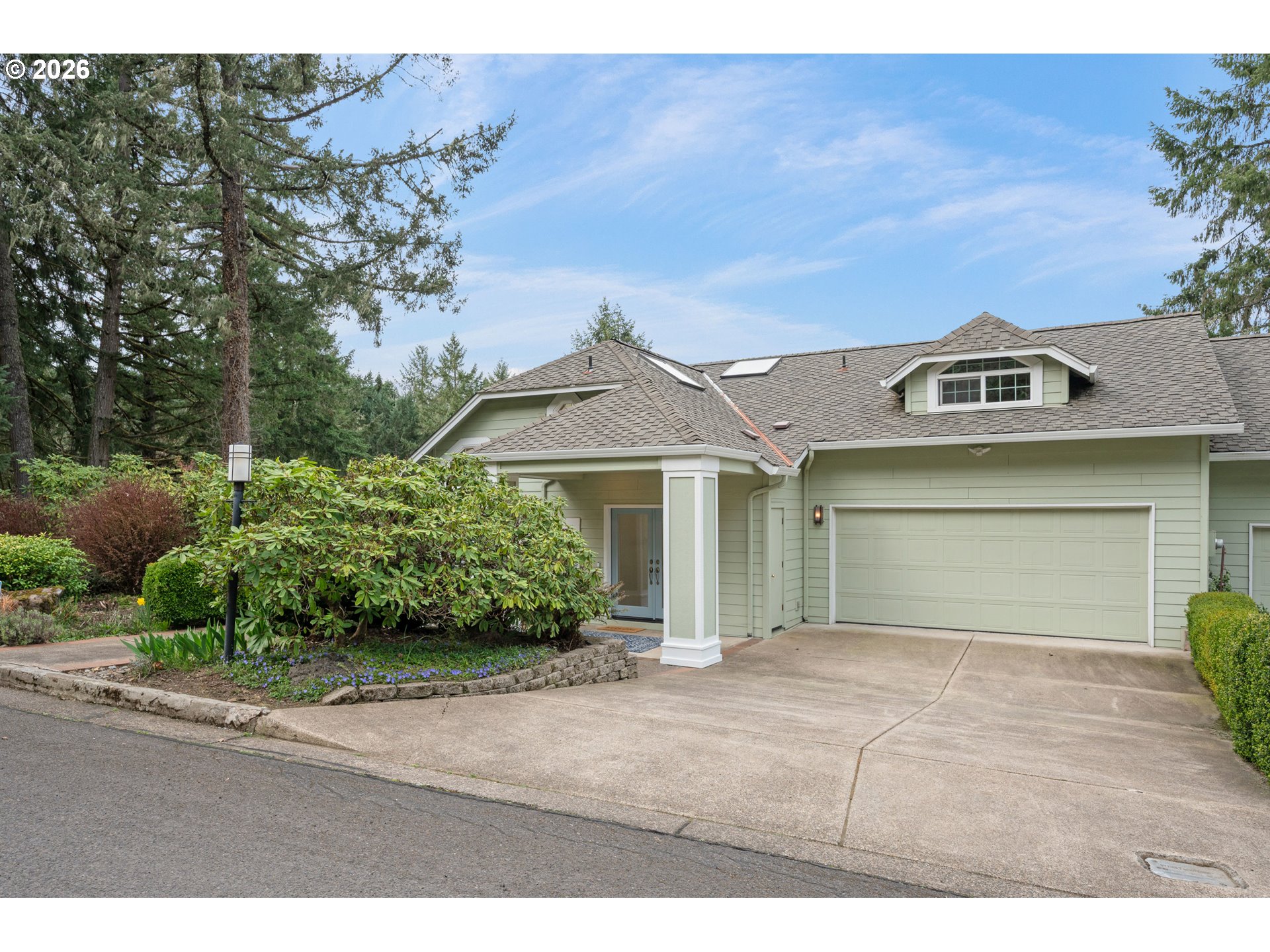 653 Brookside Drive Eugene, OR 97405 - Photo 45 of 48 front view of a house with a garden