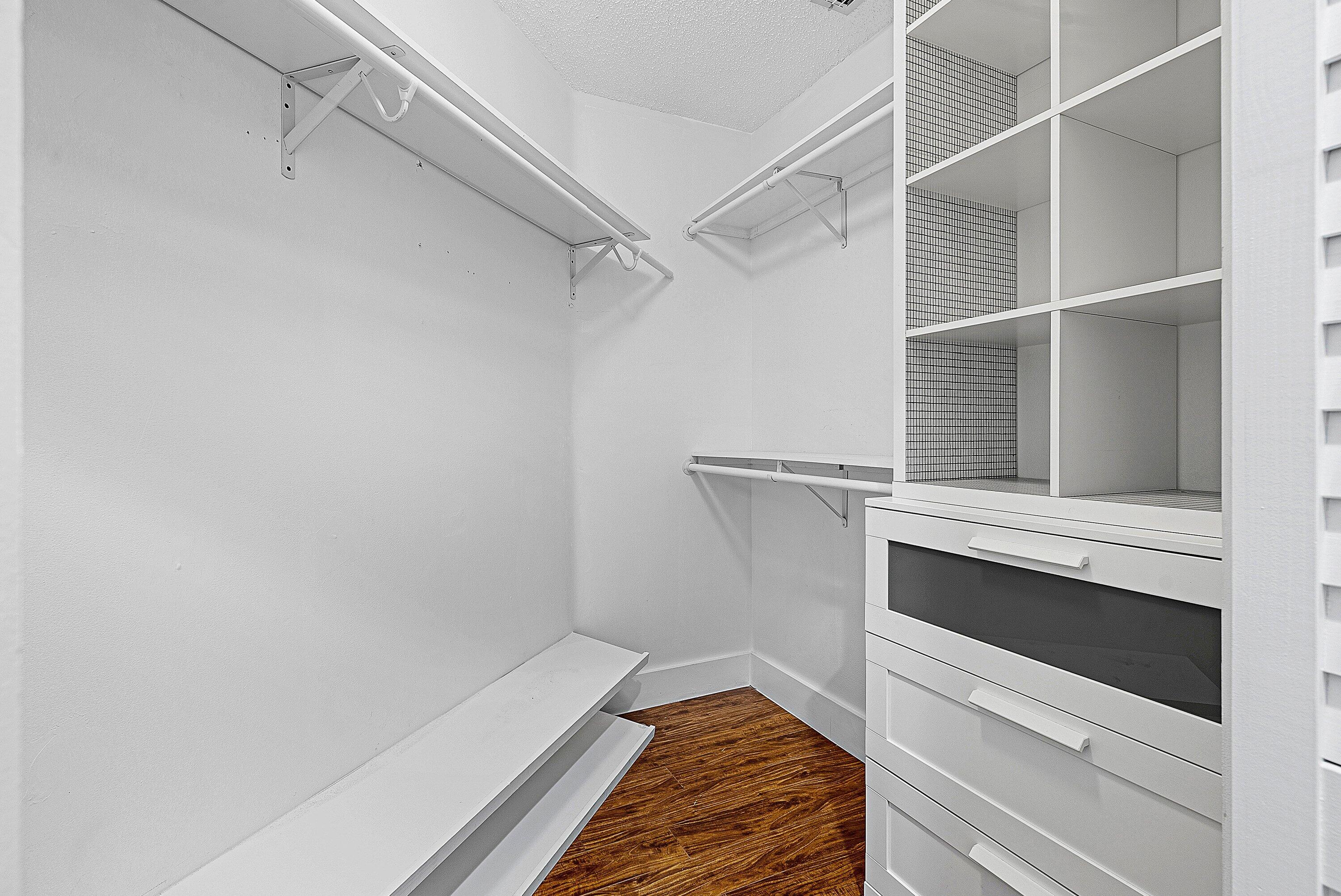 19712 Dinner Key Drive Boca Raton, FL 33498 - Photo 17 of 28 a view of walk in closet with empty racks