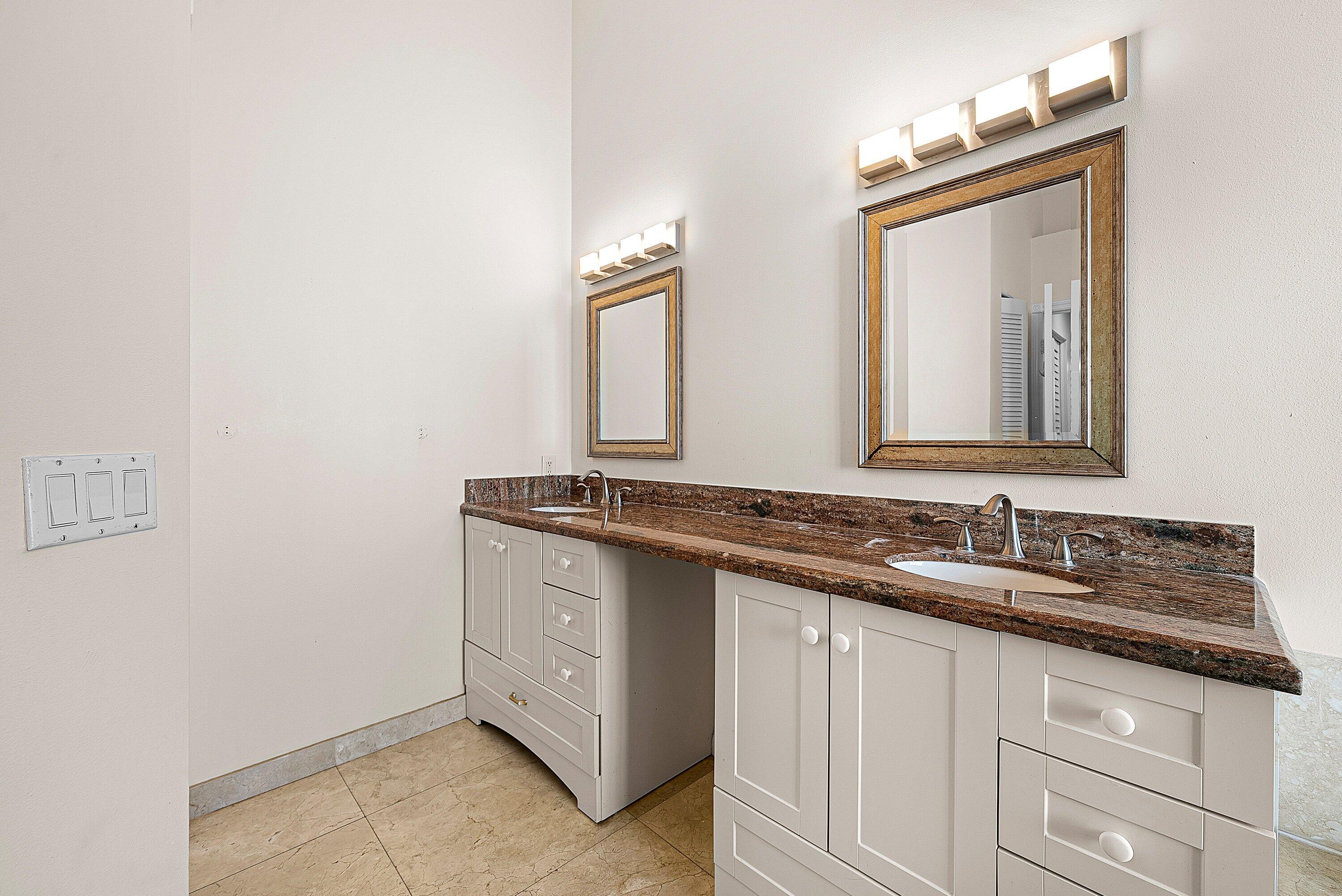 19712 Dinner Key Drive Boca Raton, FL 33498 - Photo 20 of 28 a bathroom with a granite countertop sink and a mirror