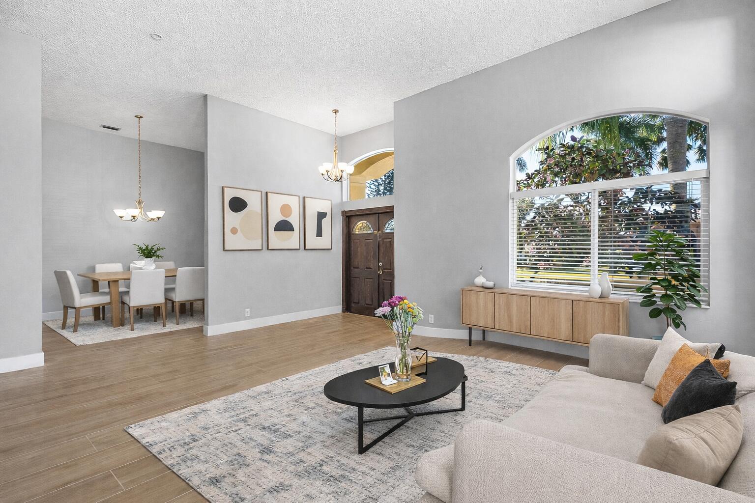 19712 Dinner Key Drive Boca Raton, FL 33498 - Photo 2 of 28 a living room with furniture and a large window
