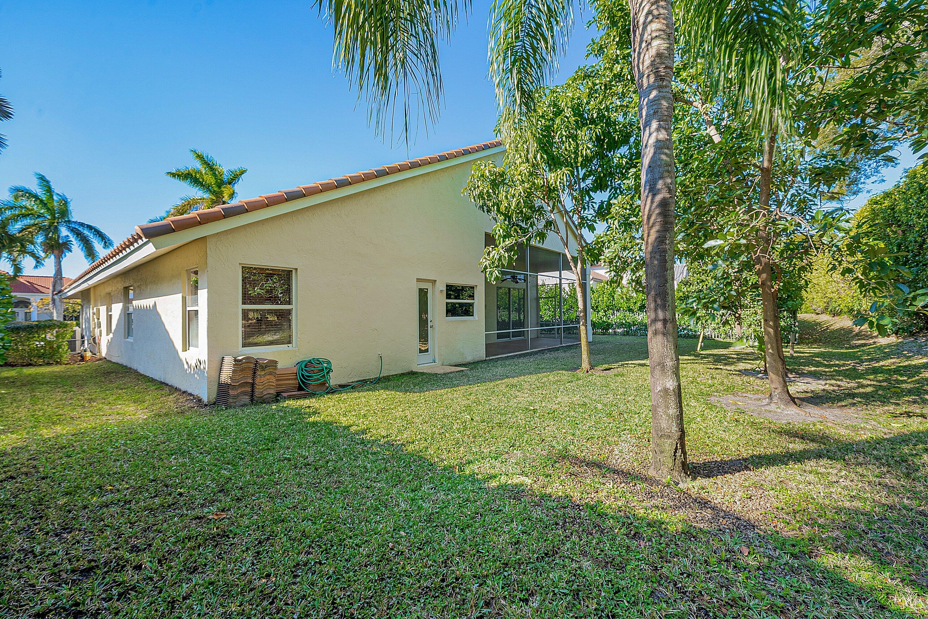 19712 Dinner Key Drive Boca Raton, FL 33498 - Photo 28 of 28 a view of a house with backyard and trees