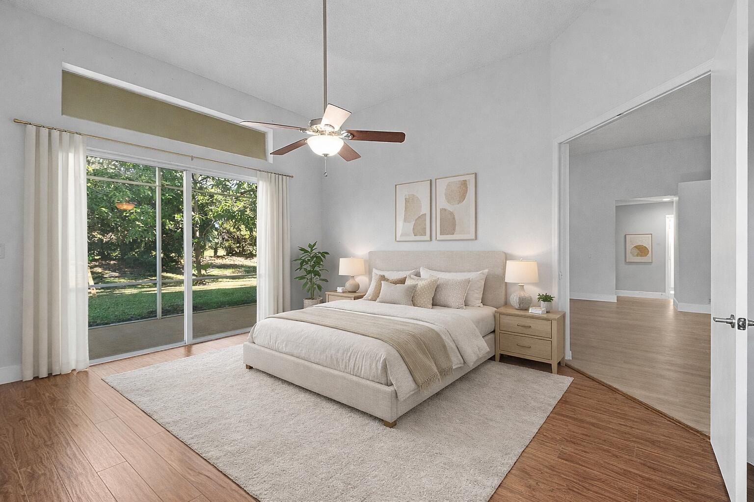 19712 Dinner Key Drive Boca Raton, FL 33498 - Photo 5 of 28 a spacious bedroom with a large bed and a chandelier