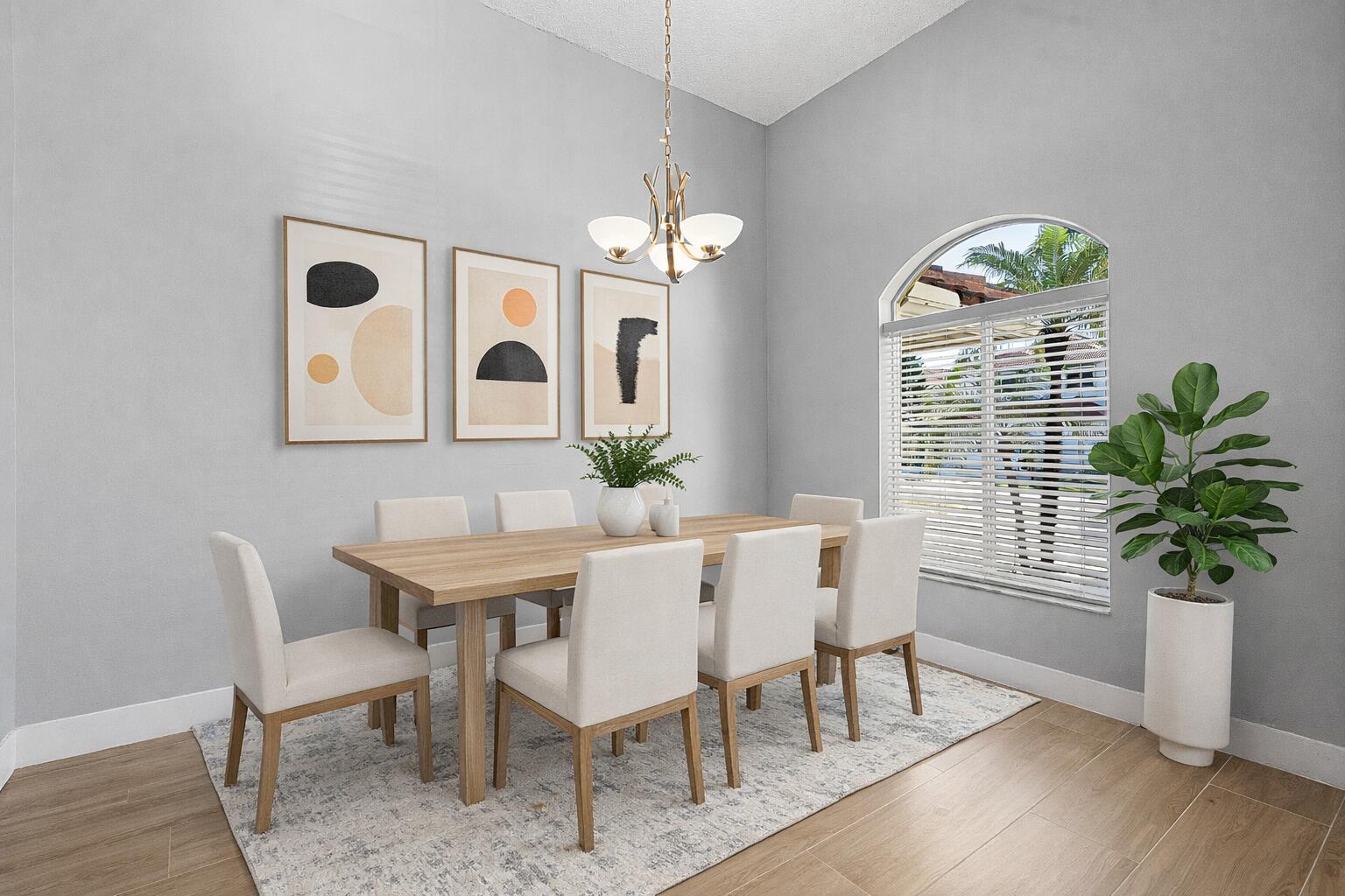 19712 Dinner Key Drive Boca Raton, FL 33498 - Photo 7 of 28 a view of a dining room with furniture a potted plant and wooden floor