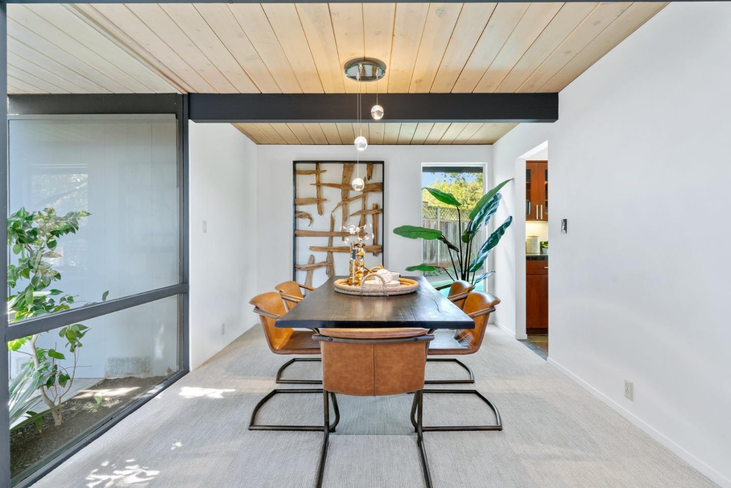 958 Eichler Drive Mountain View, CA 94040 - Photo 22 of 62 a view of a dining room with furniture and a potted plant