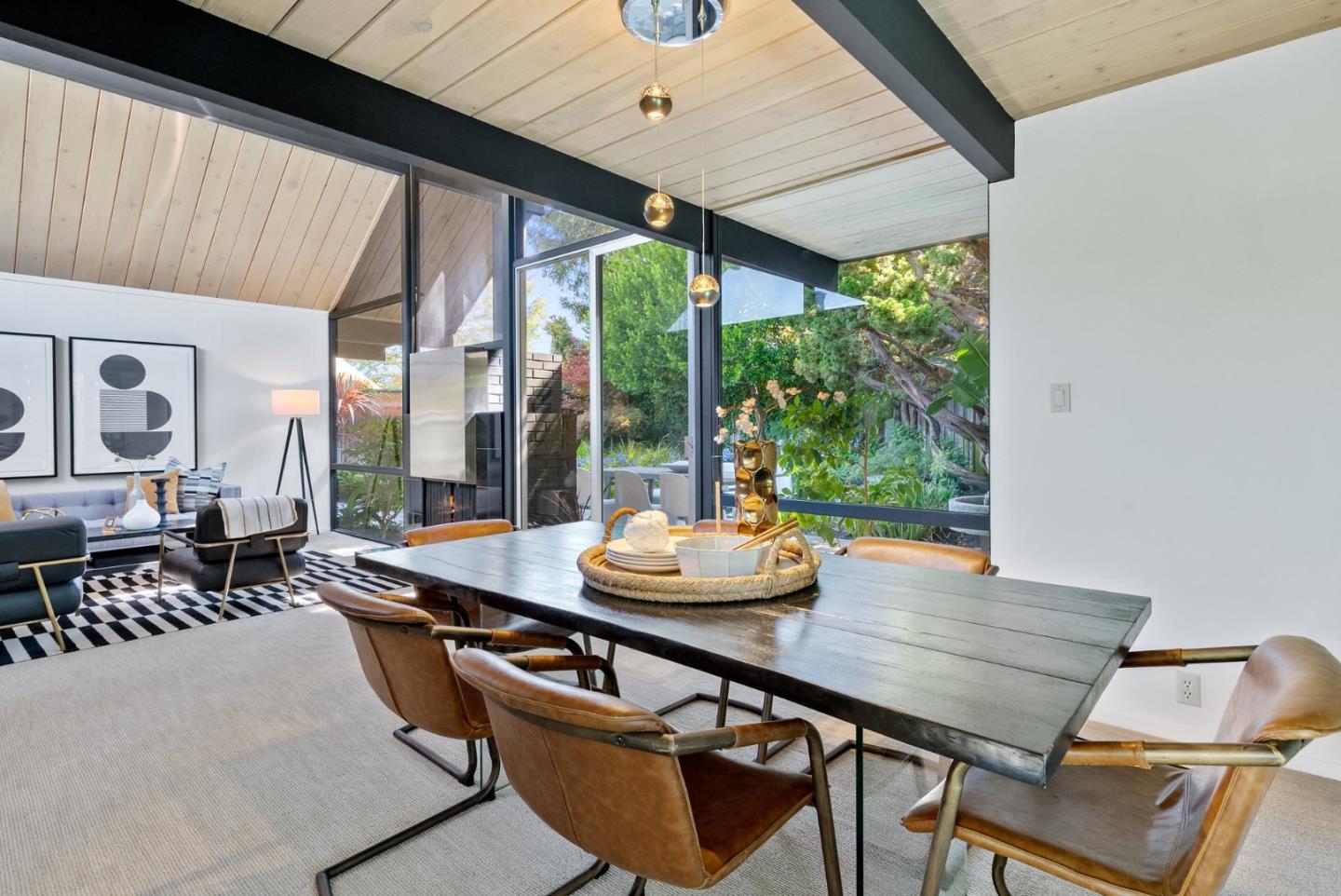 958 Eichler Drive Mountain View, CA 94040 - Photo 24 of 62 a dining room with furniture a rug and a large window