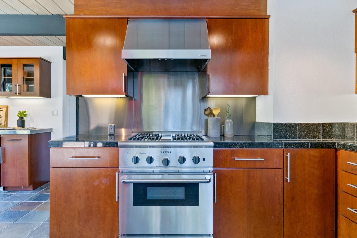 958 Eichler Drive Mountain View, CA 94040 - Photo 34 of 62 a kitchen with stainless steel appliances granite countertop a stove a sink and a refrigerator