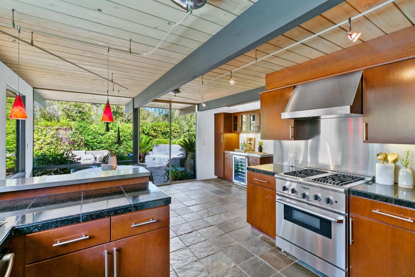 958 Eichler Drive Mountain View, CA 94040 - Photo 36 of 62 a kitchen with stainless steel appliances granite countertop a stove a sink and a refrigerator