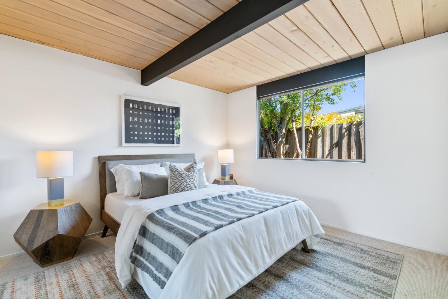 958 Eichler Drive Mountain View, CA 94040 - Photo 39 of 62 a bedroom with a bed and a wooden floor