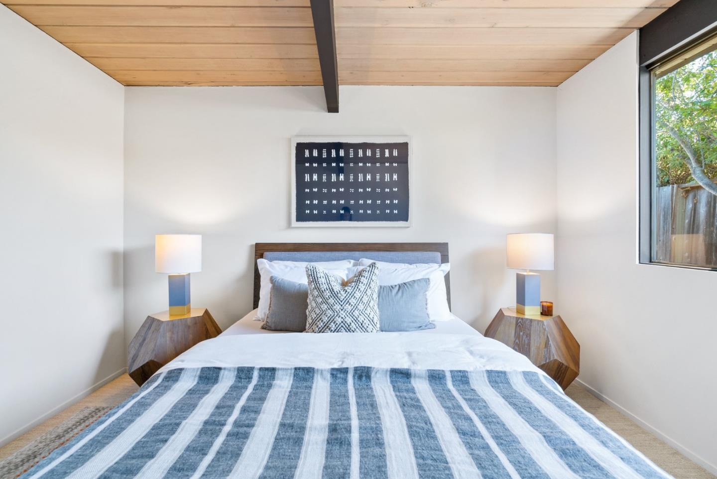 958 Eichler Drive Mountain View, CA 94040 - Photo 40 of 62 a bedroom with a bed and a lamp