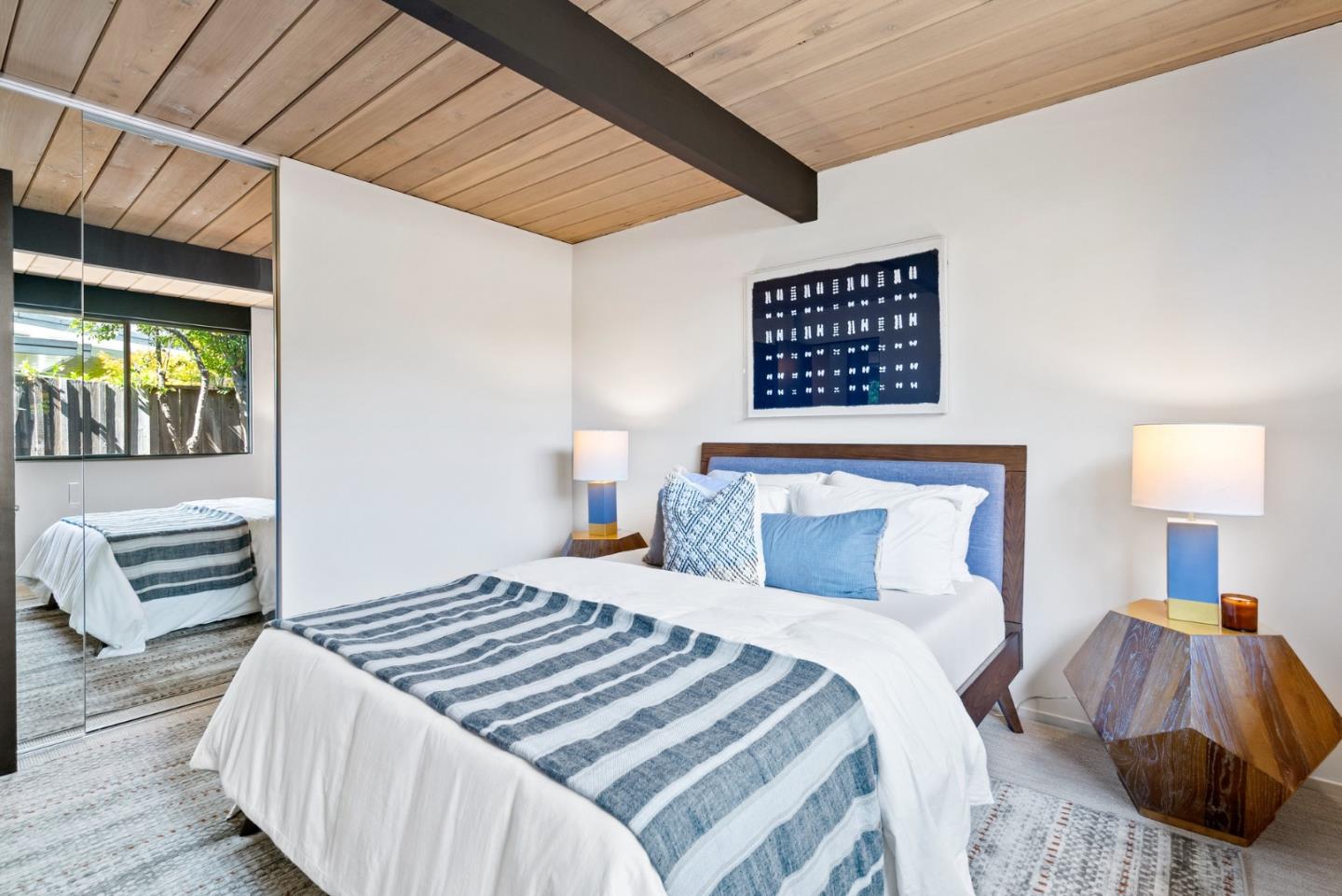 958 Eichler Drive Mountain View, CA 94040 - Photo 41 of 62 a bedroom with a bed and a lamp