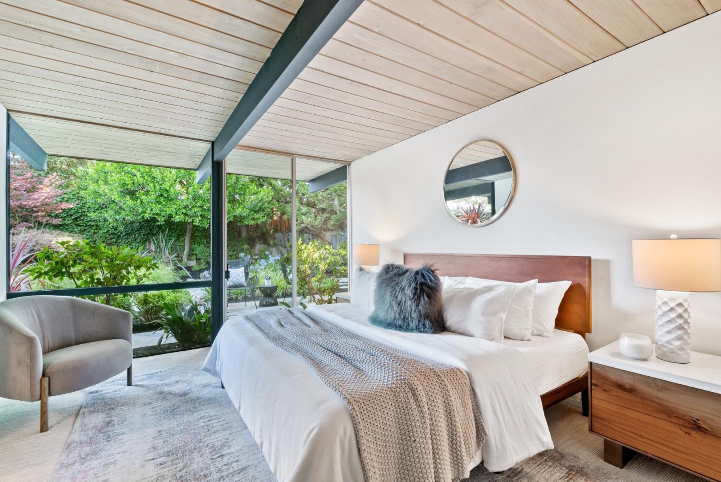 958 Eichler Drive Mountain View, CA 94040 - Photo 43 of 62 a bedroom with a bed and a large window